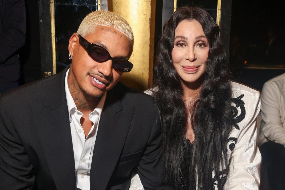 Cher (right) and boyfriend Alexander Edwards were front row at the Balmain spring/summer 2024 show (Vianney Le Caer/AP) (AP)