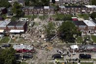 Debris and rubble covers the ground in the aftermath of an explosion in Baltimore on Monday, Aug. 10, 2020. Baltimore firefighters say an explosion has leveled several homes in the city. (AP Photo/Julio Cortez)