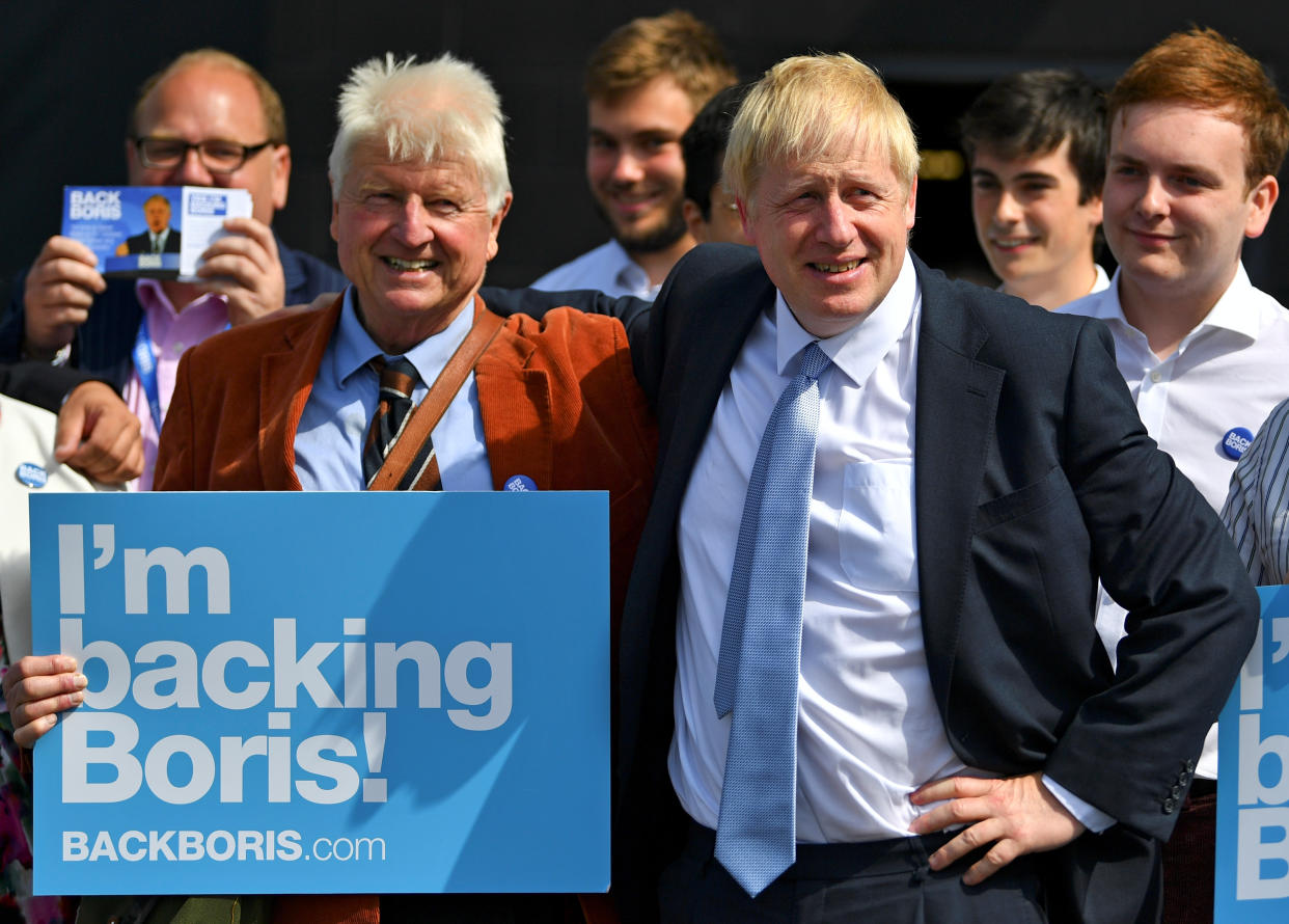 Britain's Conservative Party leadership candidate Boris Johnson and his father Stanley are seen at a hustings event, in Exeter, Britain, June 28, 2019. REUTERS/Dylan Martinez