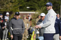 Josh Allen follows his ball as Steve Young, left, looks on during the putting challenge event of the AT&T Pebble Beach Pro-Am golf tournament in Pebble Beach, Calif., Wednesday, Feb. 1, 2023. (AP Photo/Eric Risberg)