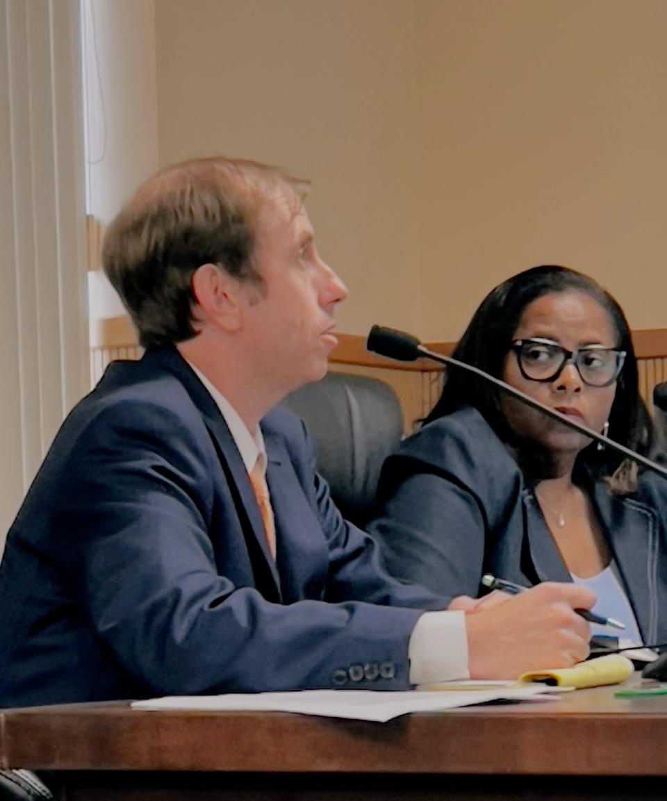 Leesburg City Attorney Grant Watson emphasizes that city charter allows City Manager Al Minner to conduct personnel changes without the commission's approval as long as it's within budget. Commissioner Allyson Berry, right, proposes more dialogue between them.