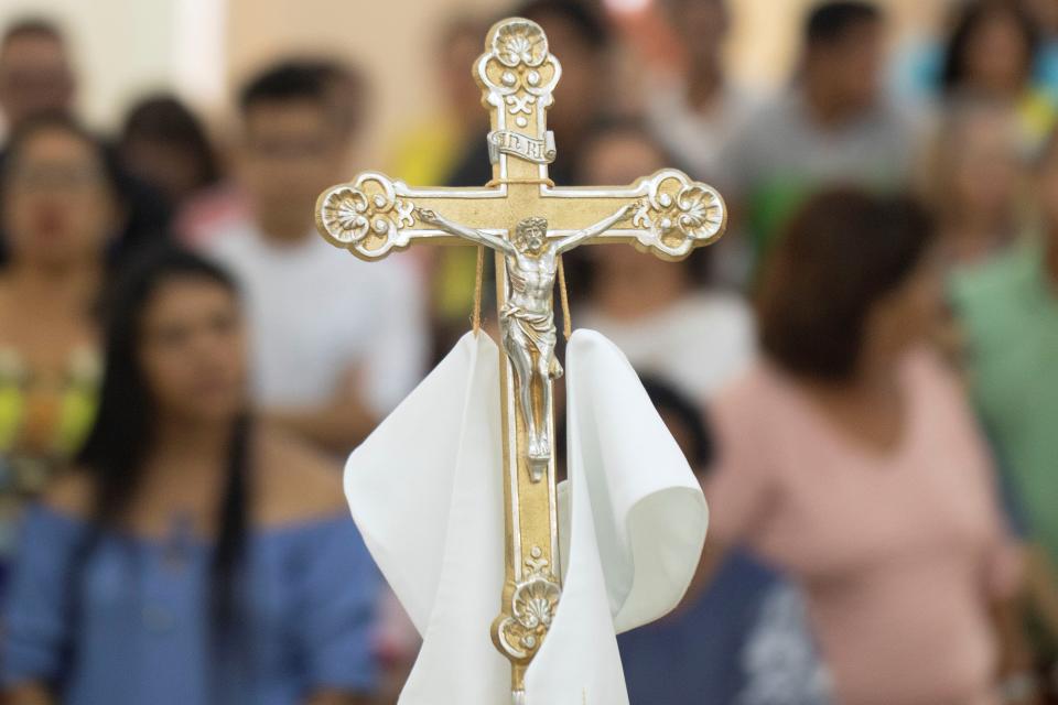 Catholic believers attend a mass in Altamira, Brazil, in August 2019.