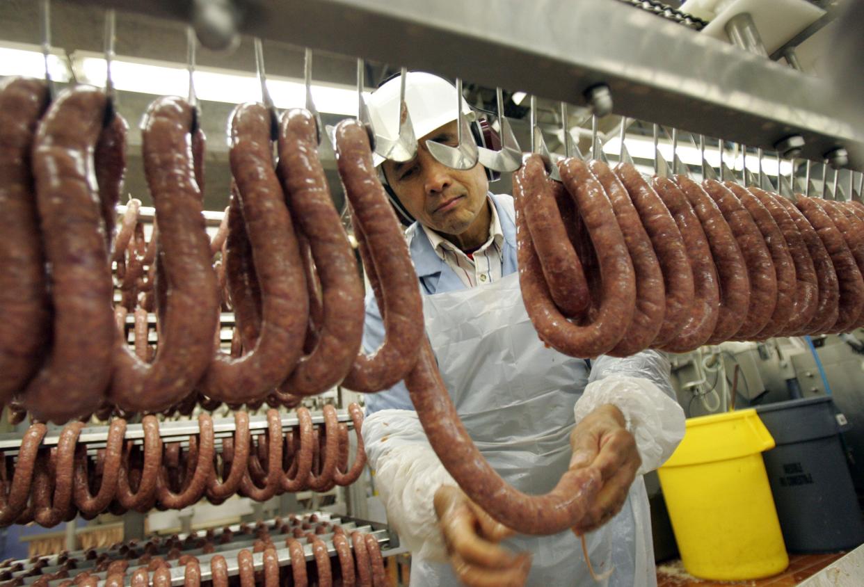 A Klement's sausage worker makes andouille sausages at the company's Milwaukee plant in this 2004 photo during the company's 50th anniversary year.
