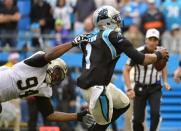 Dec 22, 2013; Charlotte, NC, USA; Carolina Panthers quarterback Cam Newton (1) is sacked by New Orleans Saints defensive end Cameron Jordan (94) in the second quarter at Bank of America Stadium. Mandatory Credit: Bob Donnan-USA TODAY Sports