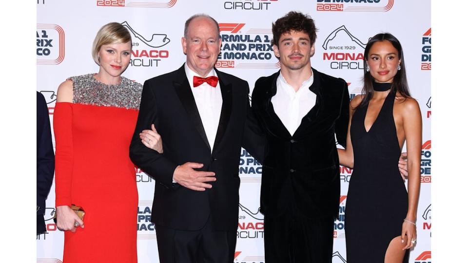 Princess Charlene of Monaco and Prince Albert II of Monaco pose with race winner Charles Leclerc and his girlfriend Alexandra Saint Mleux 