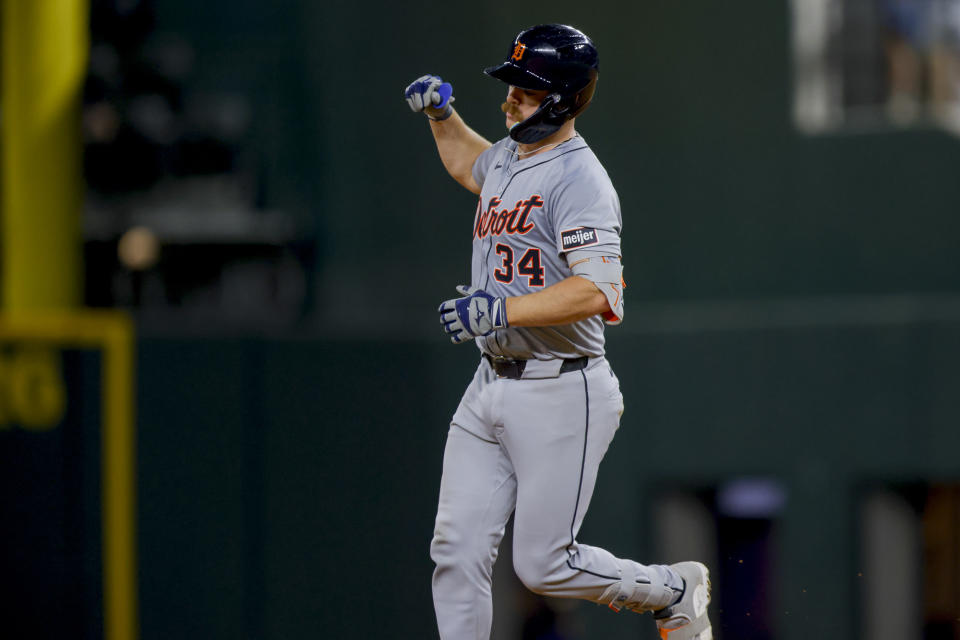 Detroit Tigers' Jake Rogers, right, pumps his fist while rounding second base after hitting his second home run of the evening during the eighth inning of a baseball game against the Texas Rangers, Monday, June 3, 2024, in Arlington, Texas. (AP Photo/Gareth Patterson)