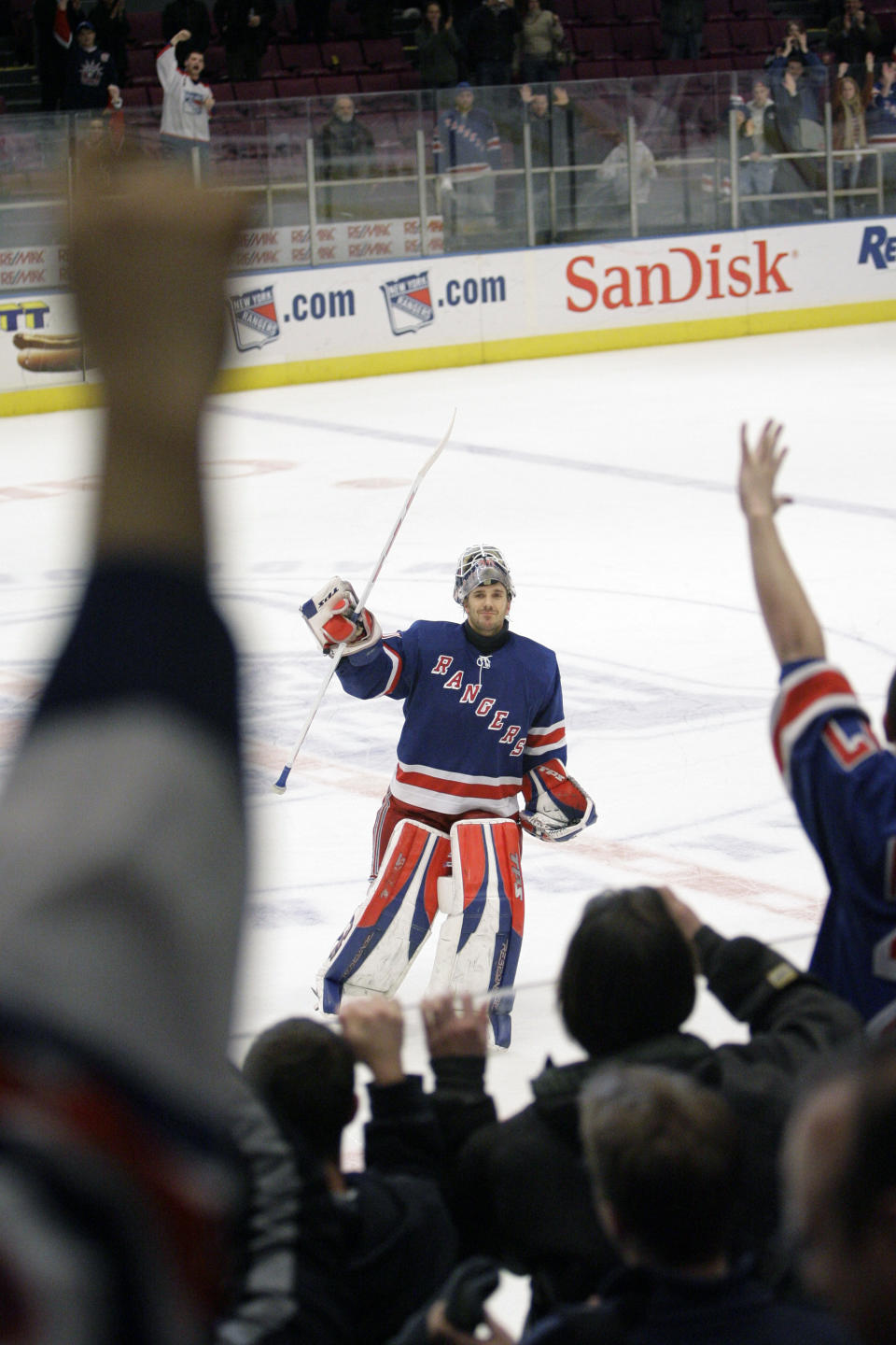 FILE - In this Tuesday, Feb. 27, 2007, file photo, New York Rangers goalie Henrik Lundqvist celebrates with the fans after being named the most valuable star of the game at the end of the third period of the NHL hockey game against the Montreal Canadiens, at Madison Square Garden in New York. The Rangers defeated the Canadiens 4-0. The New York Rangers have bought out the contract of star goaltender Henrik Lundqvist. The Rangers parted with one of the greatest netminders in franchise history on Wednesday, Sept. 30, 2020, when they paid off the final year of his contract. (AP Photo/Mary Altaffer, File)