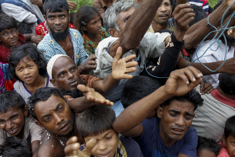 Rohingya refugees wait for aid at Kutupalong refugee camp in the town of Teknaf, Bangladesh, on Sept. 5, 2017. (Photo: K M ASAD via Getty Images)