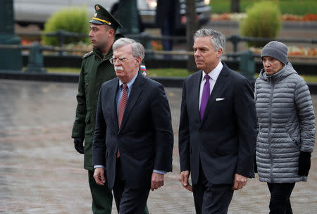 U.S. National Security Adviser John Bolton (2nd L) and U.S. ambassador to Russia Jon Huntsman (2nd R) attend a wreath-laying ceremony at the Tomb of the Unknown Soldier by the Kremlin wall in Moscow, Russia October 23, 2018. REUTERS/Sergei Karpukhin