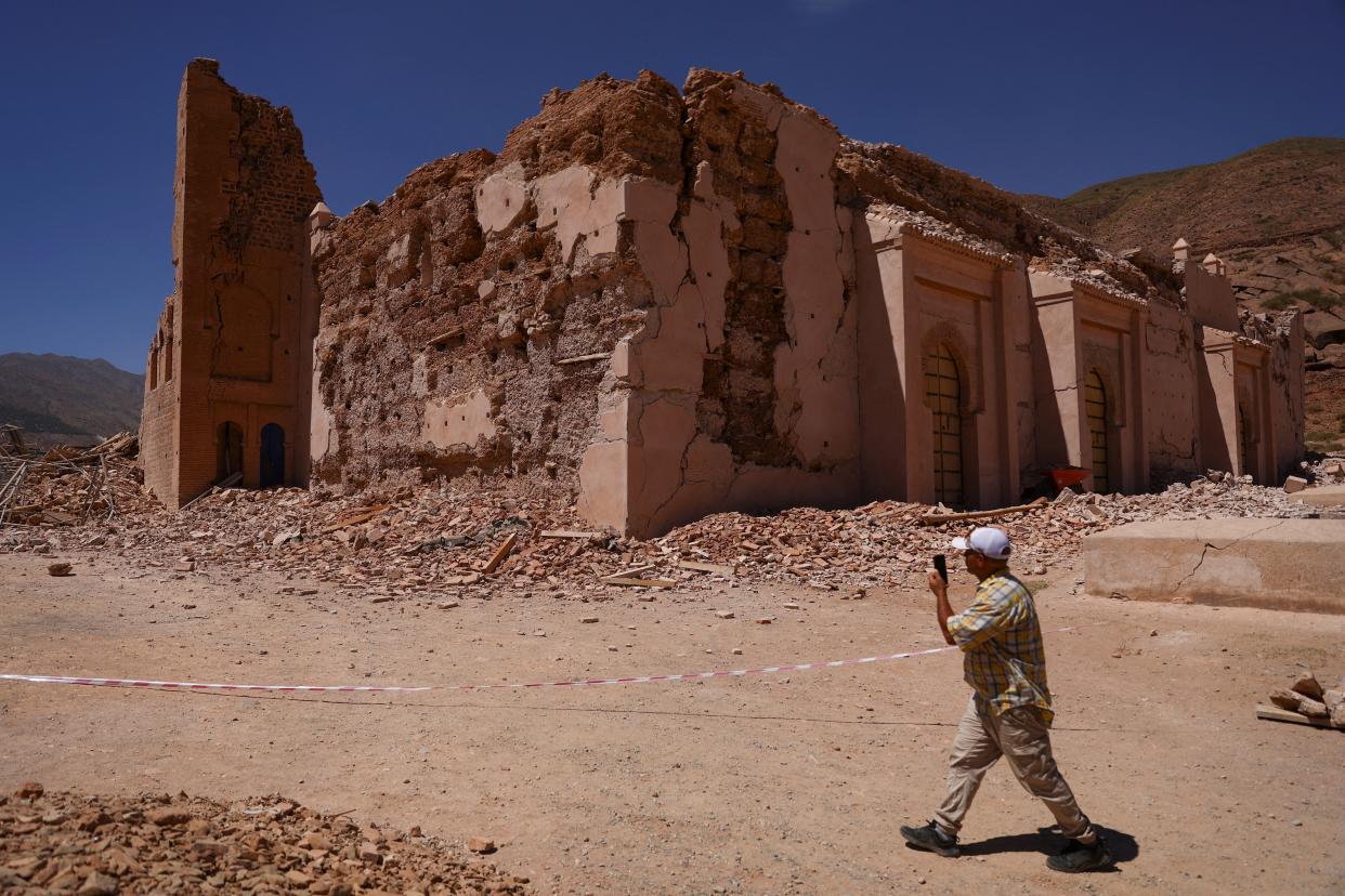 A man walks near Tinmel Mosque, which was damaged by the deadly earthquake, in Tinmel, Morocco (REUTERS)