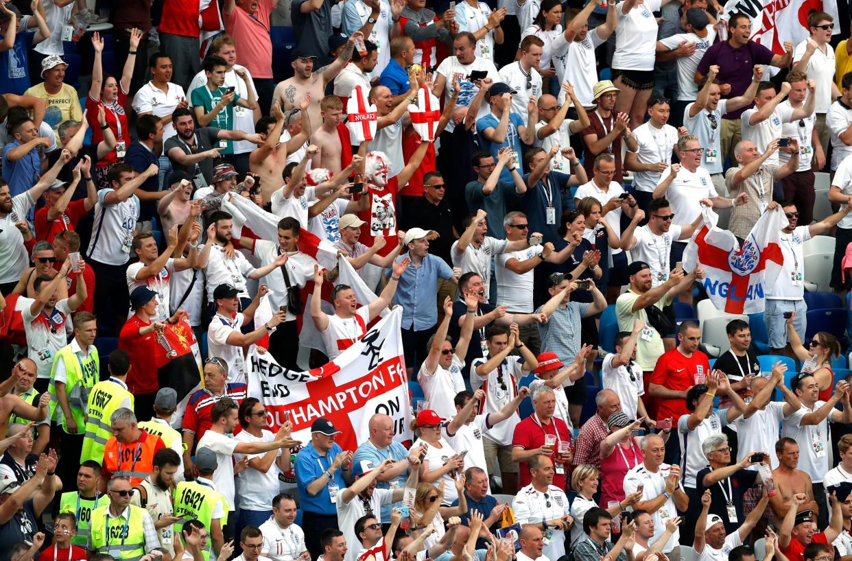 England fans go wild with joy after the team sailed into the knockout stage of the World Cup: AP