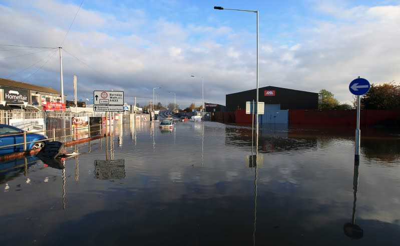 Vehicles sit in floodwater in Rotherham, near Sheffield
