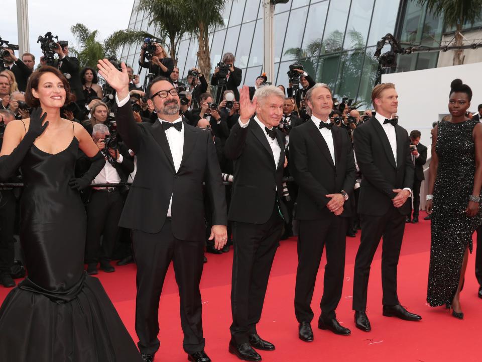 Phoebe Waller-Bridge, James Mangold, Harrison Ford, Boyd Holbrook, Mads Mikkelsen, and Shaunette Renée Wilson standing on a red carpet at the Cannes Film Festival