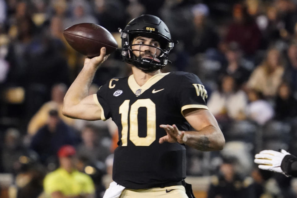 Wake Forest quarterback Sam Hartman (10) looks to pass against Army during the second half of an NCAA college football game in Winston-Salem, N.C., Saturday, Oct. 8, 2022. (AP Photo/Chuck Burton)