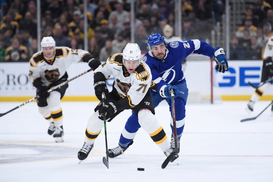 Nov. 29: The Boston Bruins' Taylor Hall (71) tries to gain control of the puck ahead of the Tampa Bay Lightning's Nicholas Paul (20) during the first period at TD Garden.