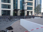 Charred debris from Tamweel Tower in JLT lies at the entrance of the tower.