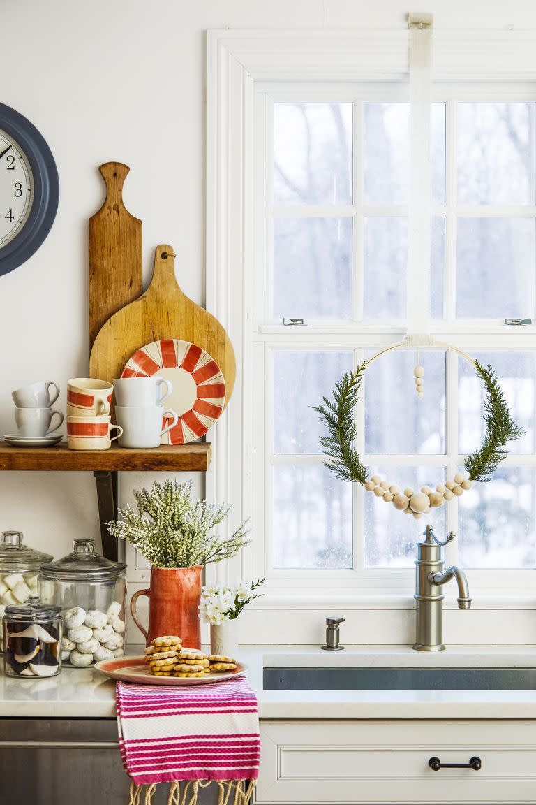 <p>If you do it right, then you can hang up your decorations before Christmas and leave 'em up all winter long. These wreaths, decked out with wooden beads and artificial pine branches, really shine on any blank wall, window, or door. </p>