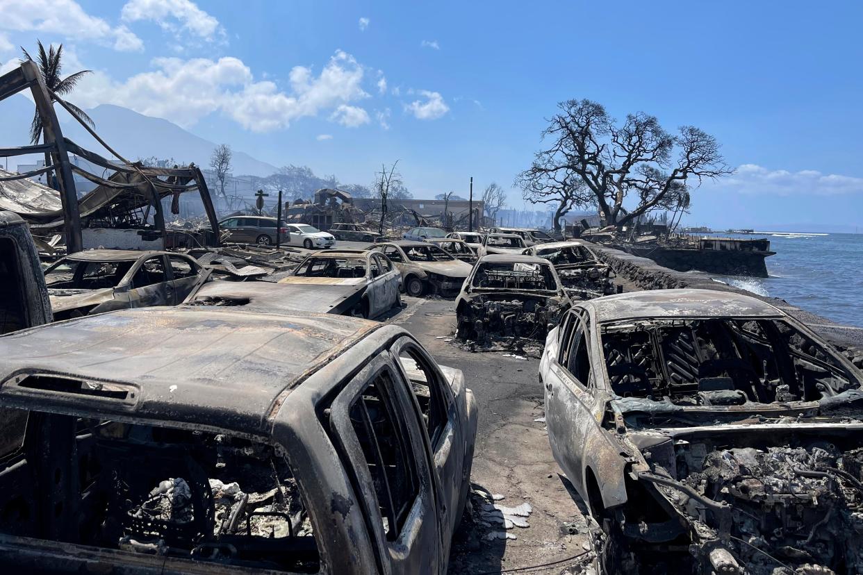 Burned out cars sit after a wildfire raged through Lahaina, Hawaii, on Wednesday, Aug. 9, 2023 (AP)