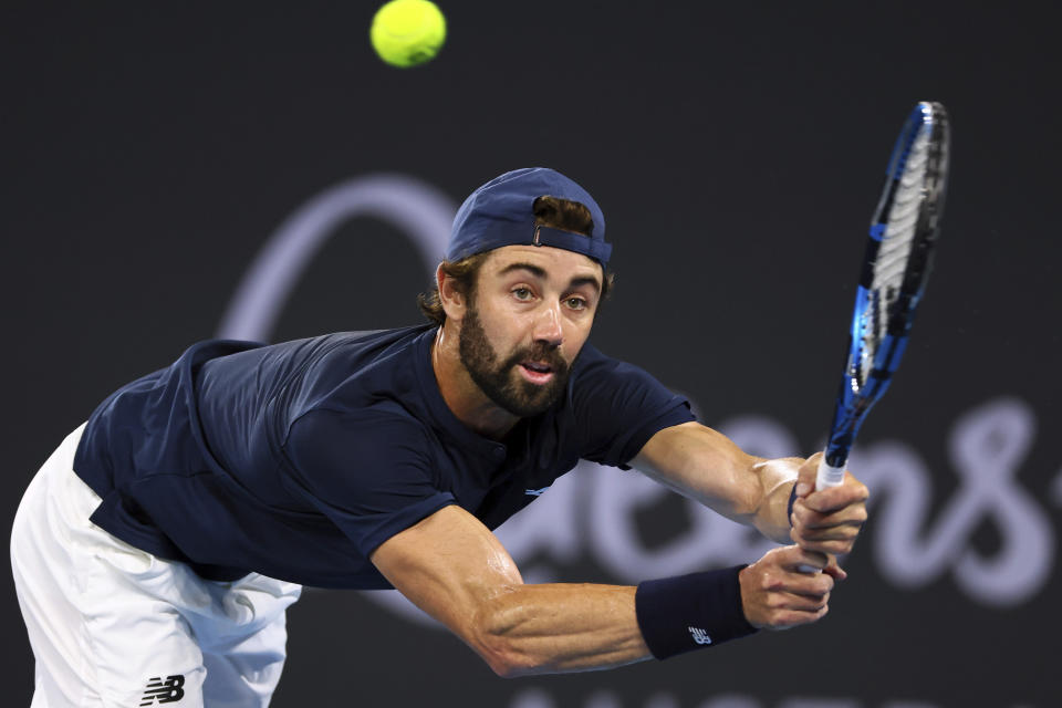 Jordan Thompson of Australia plays a shot in his semi-final match against Grigor Dimitrov of Bulgaria during the Brisbane International tennis tournament in Brisbane, Australia, Saturday, Jan. 6, 2024. (AP Photo/Tertius Pickard)