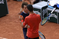 Serbia's Novak Djokovic, right, greets Norway's Casper Ruud after winning the men's singles final match of the French Open tennis tournament against him in three sets, 7-6, (7-1), 6-3, 7-5, at the Roland Garros stadium in Paris, Sunday, June 11, 2023. Djokovic won his record 23rd Grand Slam singles title, breaking a tie with Rafael Nadal for the most by a man. (AP Photo/Aurelien Morissard)