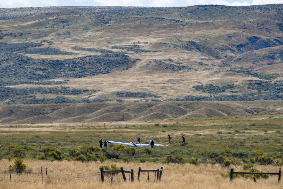 Larimer County Sheriff's Office personnel respond to the scene of a glider aircraft crash south of the Soapstone Prairie near Wellington on Thursday.