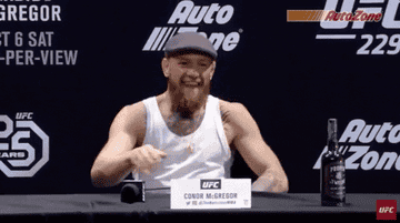 conor mcgregor rubbing hands together excitedly