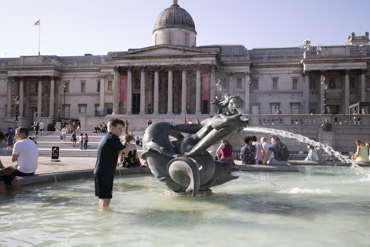 A young boy is seen playing in the fountain at Trafalgar Square ahead of a mini heatwave set to hit UK over the weekend followed by a fierce storm. The temperature will go above 30 degrees celsius on Sunday bringing on the hottest day of the year so far. (Photo by Hesther Ng / SOPA Images/Sipa USA)