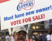 Sam Wright protests against Los Angeles Clippers owner Donald Sterling, outside Staples Center before Game 5 of the Clippers' opening-round NBA basketball playoff series against the Golden State Warriors on Tuesday, April 29, 2014, in Los Angeles. NBA Commissioner Adam Silver announced Tuesday that Sterling has been banned for life by the league for making racist comments that hurt the league. (AP Photo/Ringo H.W. Chiu)