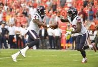 Aug 9, 2018; Kansas City, MO, USA; Houston Texans quarterback Deshaun Watson (4) hands off to running back Lamar Miller (26) during the first half against the Kansas City Chiefs at Arrowhead Stadium. Denny Medley-USA TODAY Sports