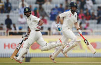 India v Australia - Third Test cricket match - Jharkhand State Cricket Association Stadium, Ranchi, India - 19/03/17 - India's Cheteshwar Pujara (R) and Wriddhiman Saha run between the wickets. REUTERS/Adnan Abidi