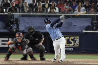 Tampa Bay Rays Mike Zunino hits an RBI single in the fifth inning in Game 1 of a baseball American League Championship Series against the Houston Astros, Sunday, Oct. 11, 2020, in San Diego. (AP Photo/Jae C. Hong)