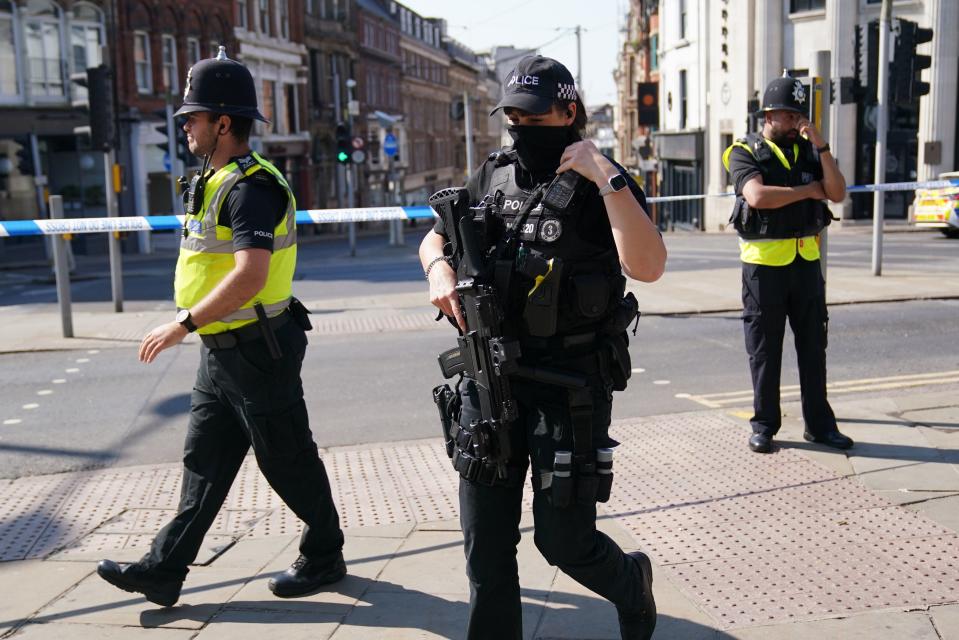 Police officers in Nottingham city centre (PA)