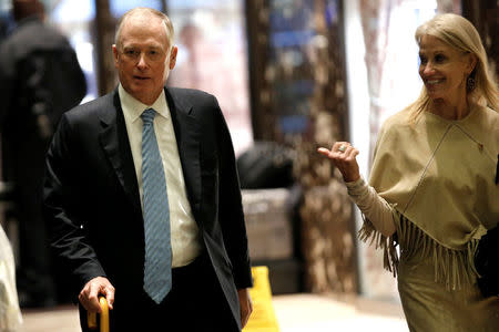 Kellyanne Conway, campaign manager and senior advisor to the Trump Presidential Transition Team walks with former U.S. Vice President Dan Quayle at Trump Tower as he arrives to meet with U.S. President-elect Donald Trump in New York, U.S., November 29, 2016. REUTERS/Mike Segar