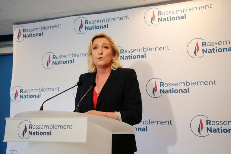 French far right leader Marine Le Pen reacts to the results of regional election, in Nanterre