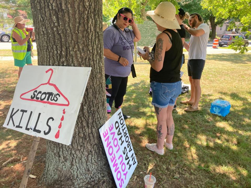 Lisa Lemieux, president of the Greater Southeastern Massachusetts Labor Council, speaks with a demonstrator at Buttonwood Park as demonstrators assemble to march in protest of the Supreme Court's decision to overturn Roe v. Wade on Saturday, July 9.