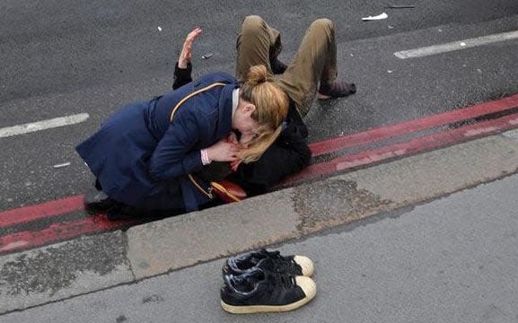 Cara and Stephen Lockwood were photographed at the scene but it was unclear who they were amid the confusion