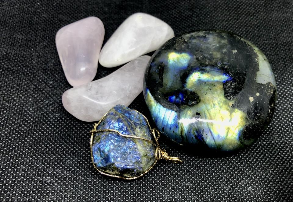 Clockwise from right: labradorite, lapis lazuli, rose quartz