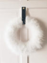 This photo shows a feather hanging wreath in white sold at the Etsy.com shop fernandthefawn. From tablescapes to apparel, the gift possibilities in white are endless for the holidays. (AP Photo/fernandthefaw.etsy.com)