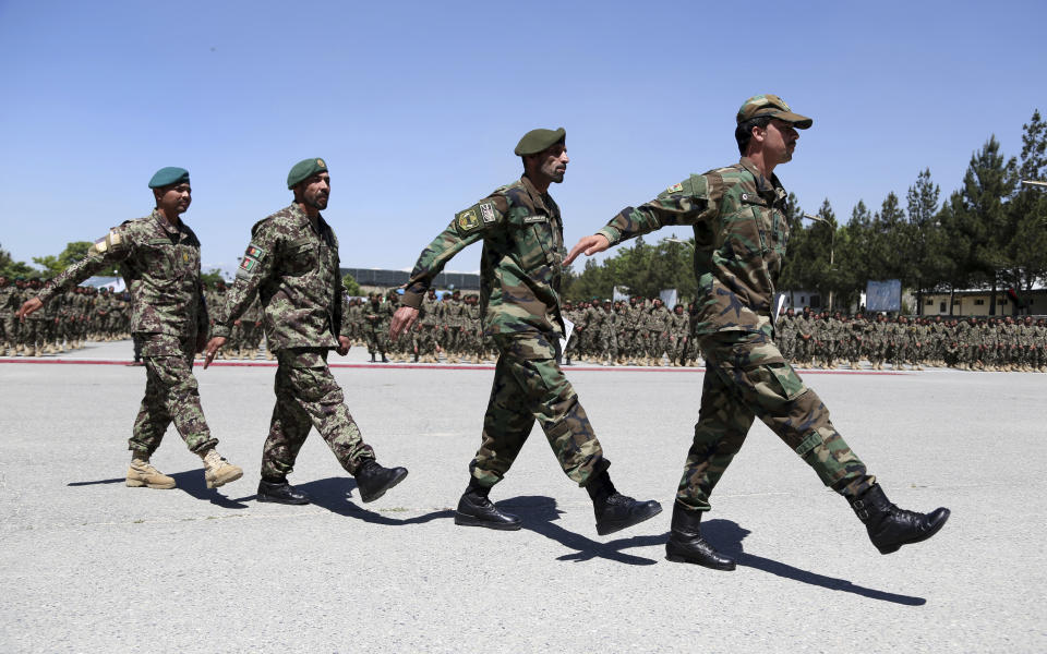 Afghan National Army soldiers march during their graduation ceremony from a 3-month training program at the Afghan Military Academy in Kabul, Afghanistan, Monday, May 27, 2019. (AP Photo/Rahmat Gul)