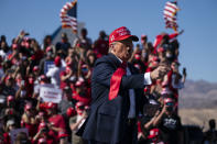 President Donald Trump points to the crowd as he walks off stage after speaking during a campaign rally at Laughlin/Bullhead International Airport, Wednesday, Oct. 28, 2020, in Bullhead City, Ariz. (AP Photo/Evan Vucci)