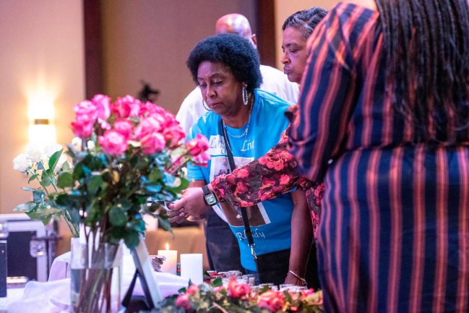 Family members of Randy Johnson light candles around a photo of him during a candlelight ceremony as a part of National Crime Victims’ Rights Week at First Baptist Church of Gulfport on Tuesday, April 23, 2024. Randy Johnson, 41, was shot and killed on Sept. 18, 2021 at the Golden Nugget Casino in Biloxi.