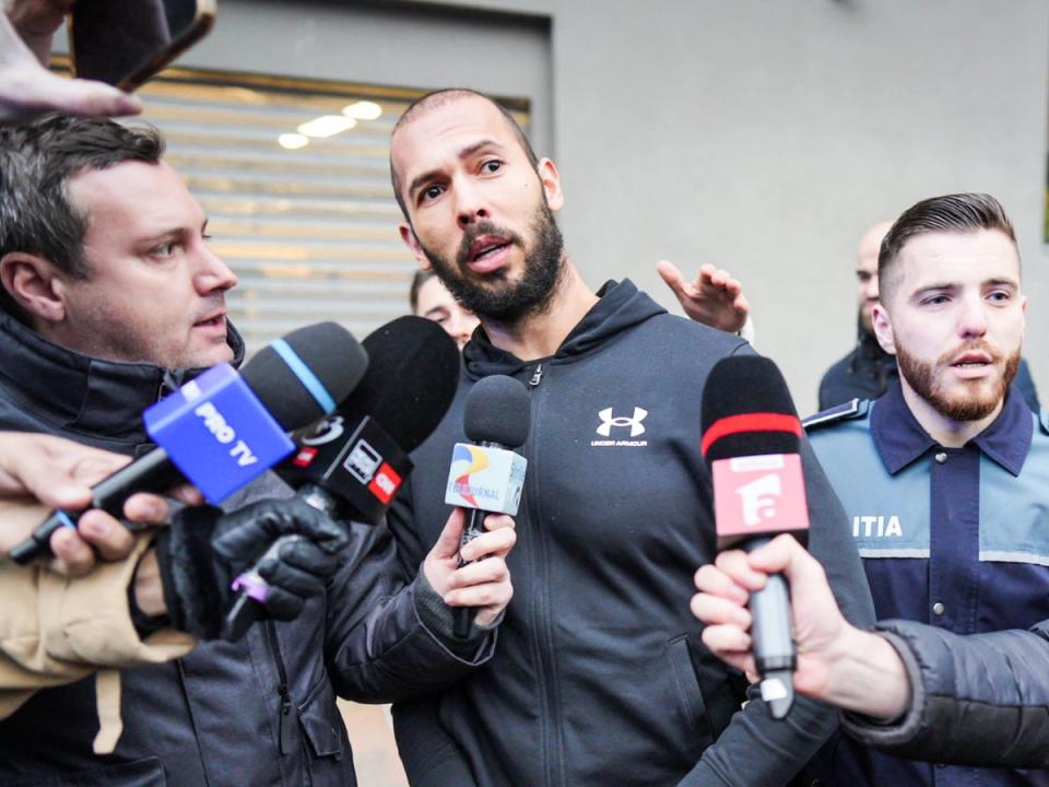 Tate speaks to reporters in Bucharest – he and his brother will be forced to stay in detention until late February (AFP via Getty Images)