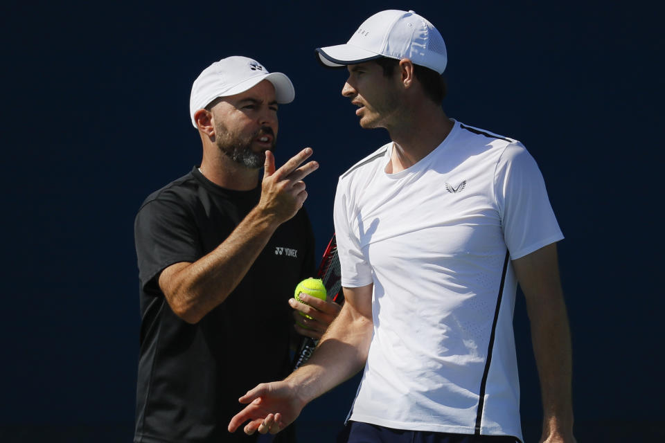 Andy Murray, right, of Britain, speaks to his coach Jamie Delgado, left, at the Western & Southern Open tennis tournament, Sunday, Sunday, Aug. 11, 2019, in Mason, Ohio. (AP Photo/John Minchillo)