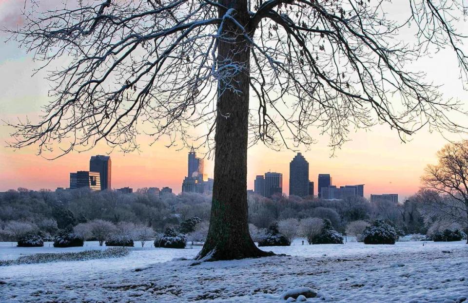 The view of the Raleigh skyline just before sunrise from Dix Park on Friday, February 22, 2020 in Raleigh, N.C., after a winter storm passed through the area overnight. Robert Willett/rwillett@newsobserver.com