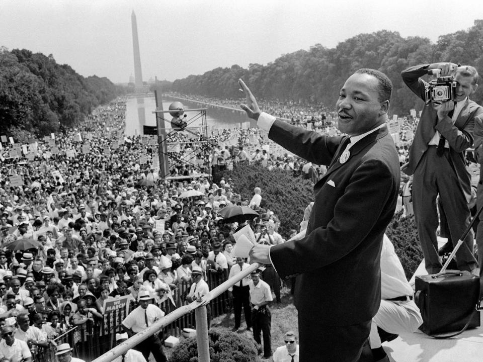 Civil rights leader Dr. Martin Luther King Jr. waves to supporters August 28, 1963 on the Mall in Washington, D.C.  / Credit: AFP via Getty Images