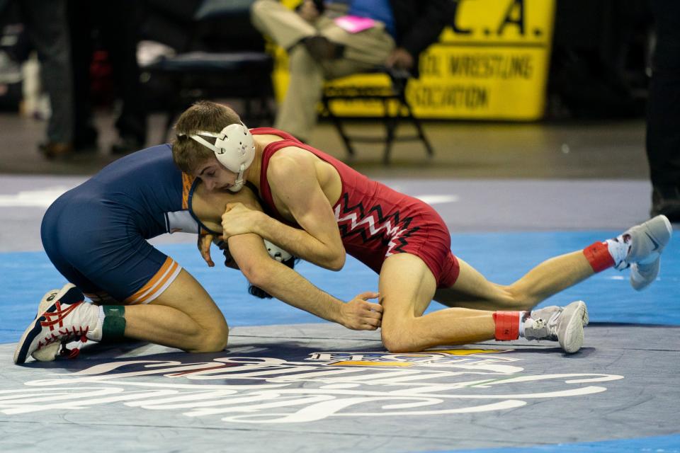 Charlie LaRocca of Center Grove and Adrian Origel of North Newton compete in the 120-pound first round match of 2023-24 IHSAA State Wrestling tournament at Ford Center in Evansville, Ind., Friday, Feb. 16, 2024.