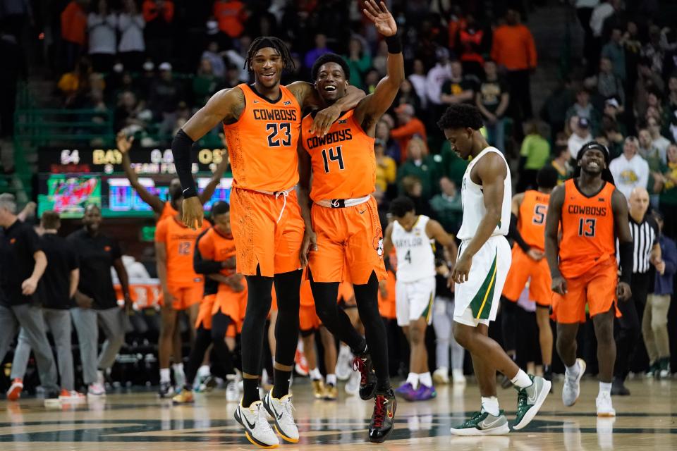 Oklahoma State guard Bryce Williams celebrates with forward Tyreek Smith (23) following the Cowboys' victory over Baylor at Ferrell Center.