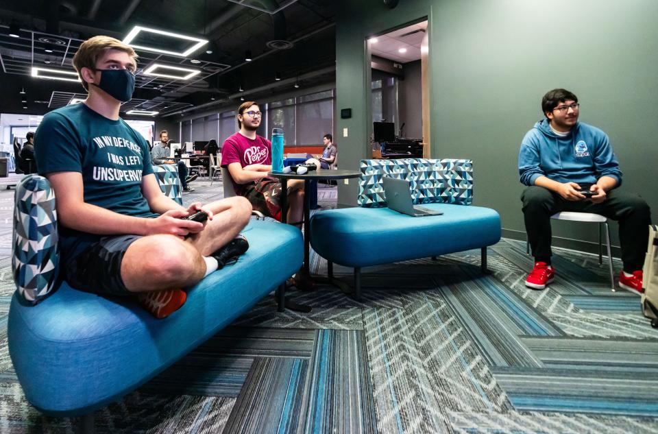 Students, from left, Collin Aschenbrenner, Brodi Klosinski and Marcelino Promotor, play Super Smash Bros. in the new sports gaming lab at Waukesha County Technical College.