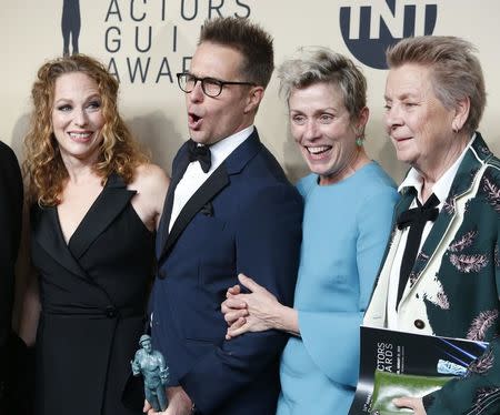 24th Screen Actors Guild Awards – Photo Room – Los Angeles, California, U.S., 21/01/2018 – Frances McDormand (C), who won the award for Outstanding Performance by a Female Actor in a Leading Role, Sam Rockwell, who won the award for Outstanding Performance by a Male Actor in a Supporting Role, and the cast of "Three Billboards Outside Ebbing, Missouri" pose backstage with their awards for Outstanding Cast in a Motion Picture. REUTERS/Monica Almeida