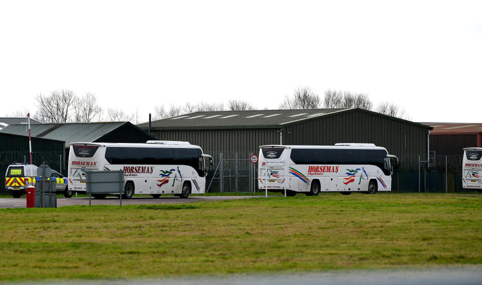 Coaches enter RAF Brize Norton in Oxfordshire, where a plane carrying British nationals from the coronavirus-hit city of Wuhan in China, is due to arrive on Friday. (Ben Birchall/PA Wire)